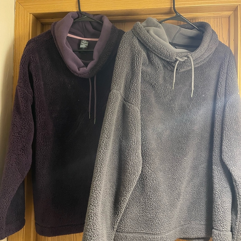 Champion fleece sweaters. 1 grey and 1 purple